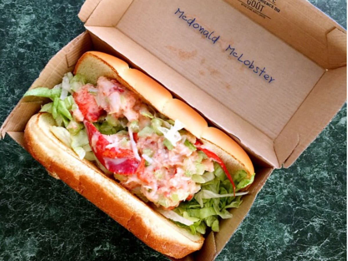 A lobster sandwich on a table.