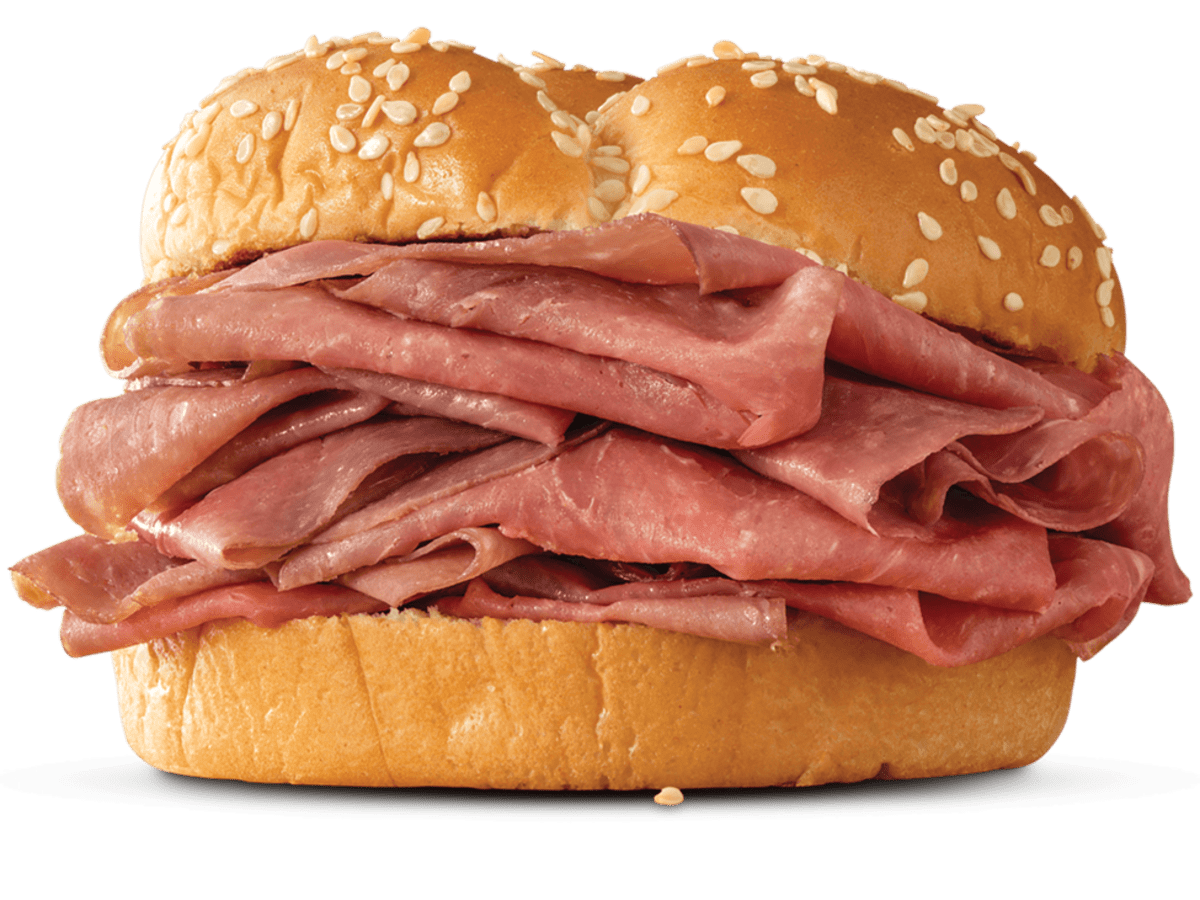 A ham sandwich on a white background.