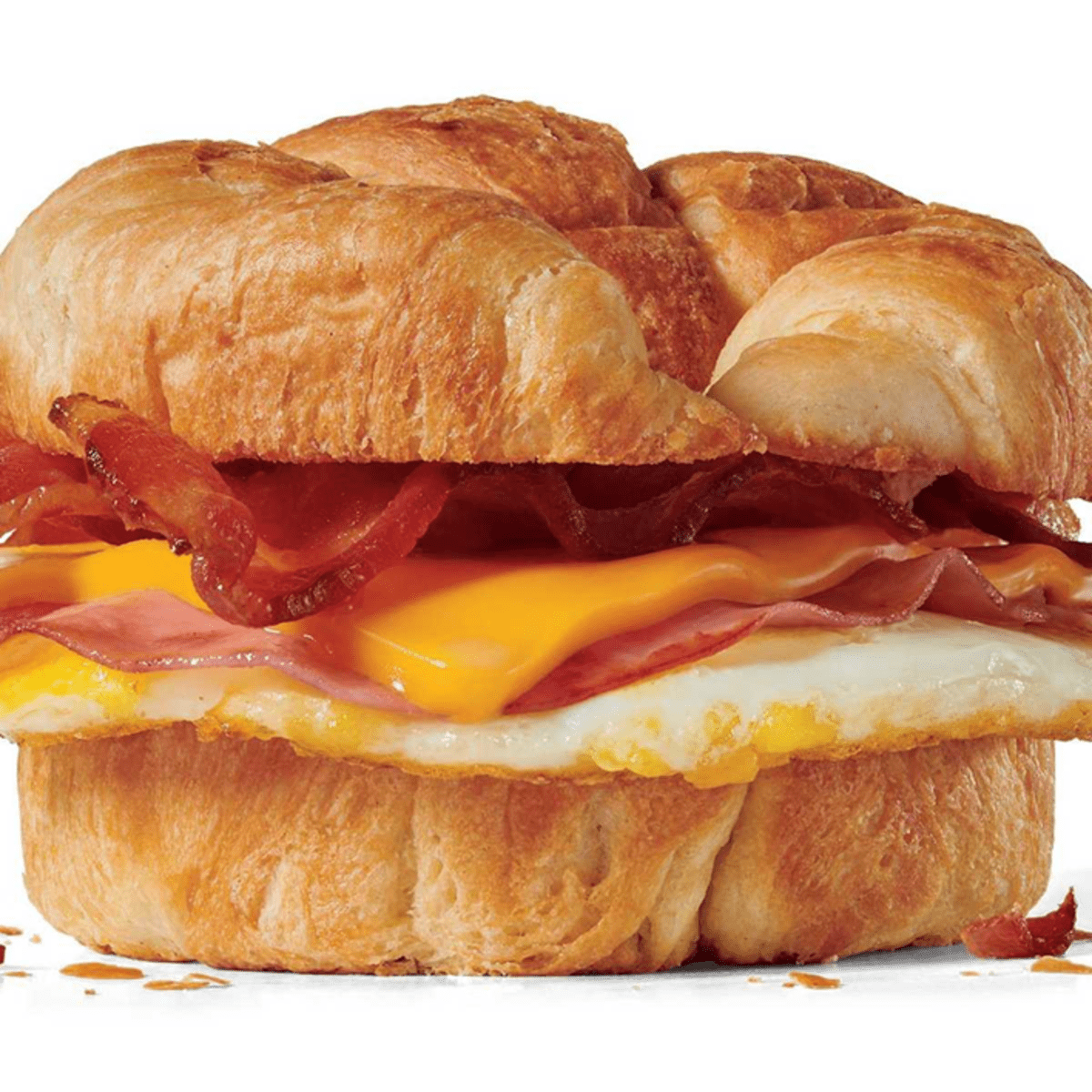 A croissant sandwich with bacon, eggs and cheese.