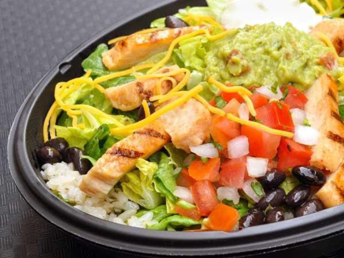 A gluten-free chicken salad bowl with rice and beans.