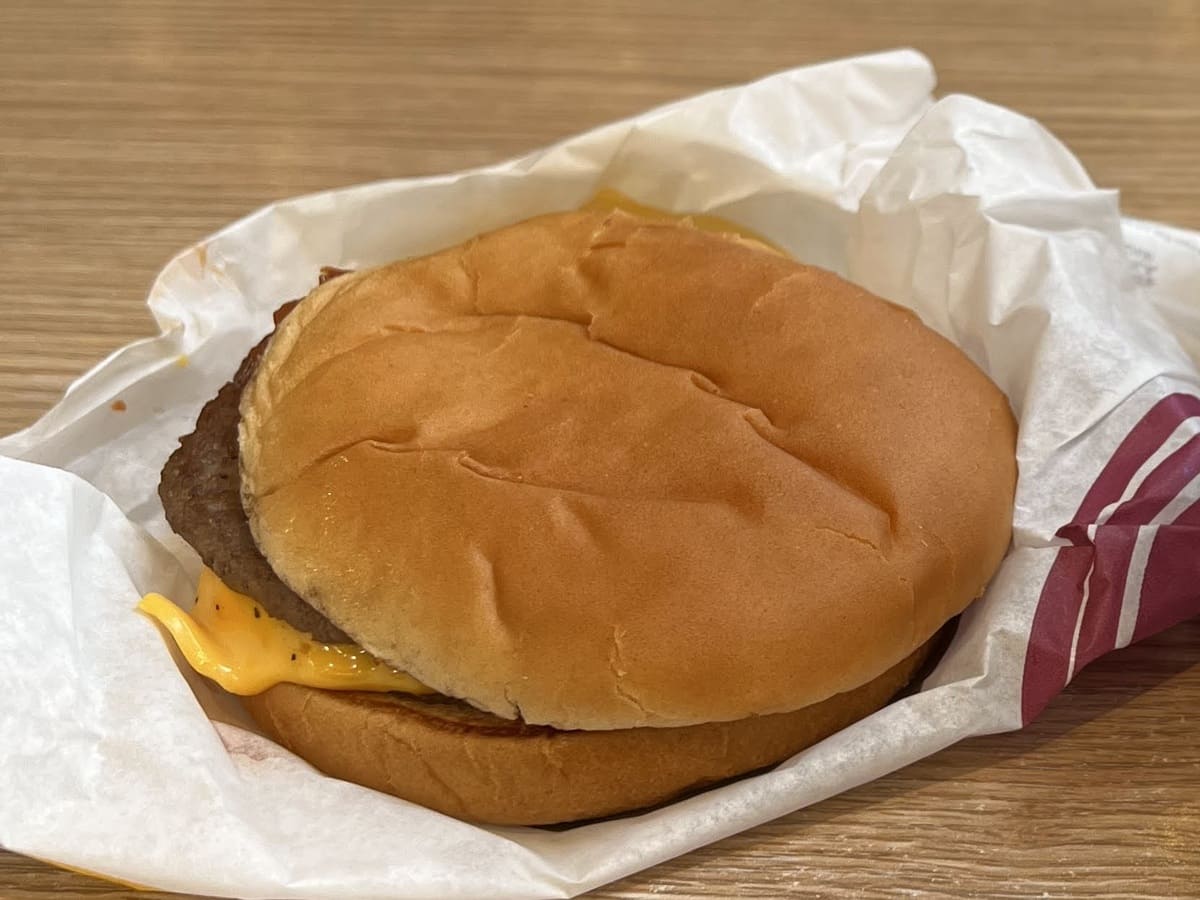 A mcdonald's burger sitting on a table.