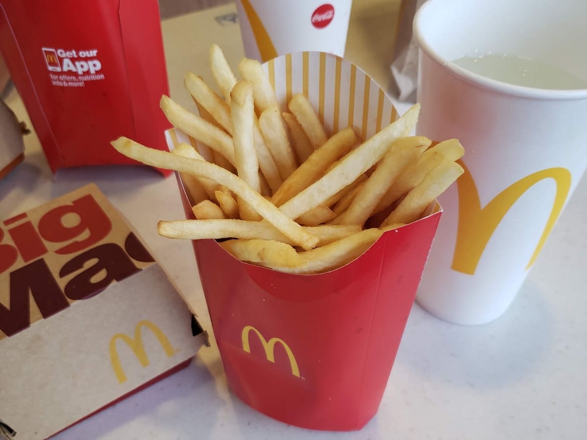Mcdonald's french fries and a cup of water.