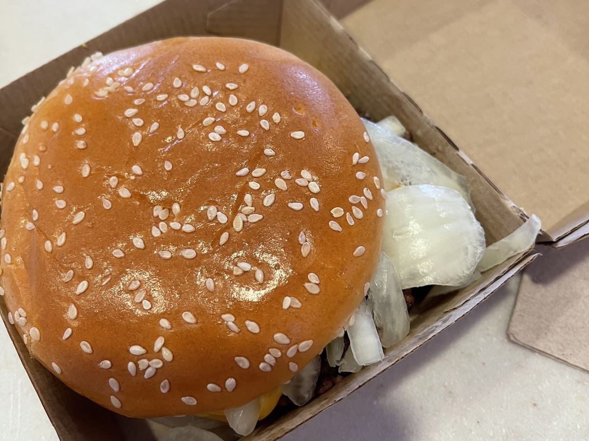 Mcdonald's burger in a cardboard box.
